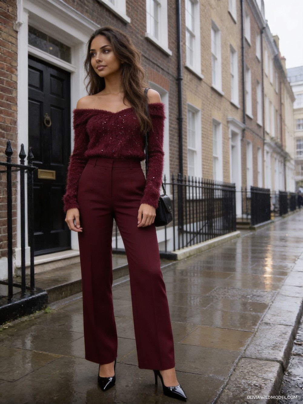 Fall street-style outfit on a London street: burgundy fuzzy off-shoulder blouse with rhinestone trim, burgundy wide-leg tailored trousers, black patent pointed-toe pumps and a black shoulder bag
